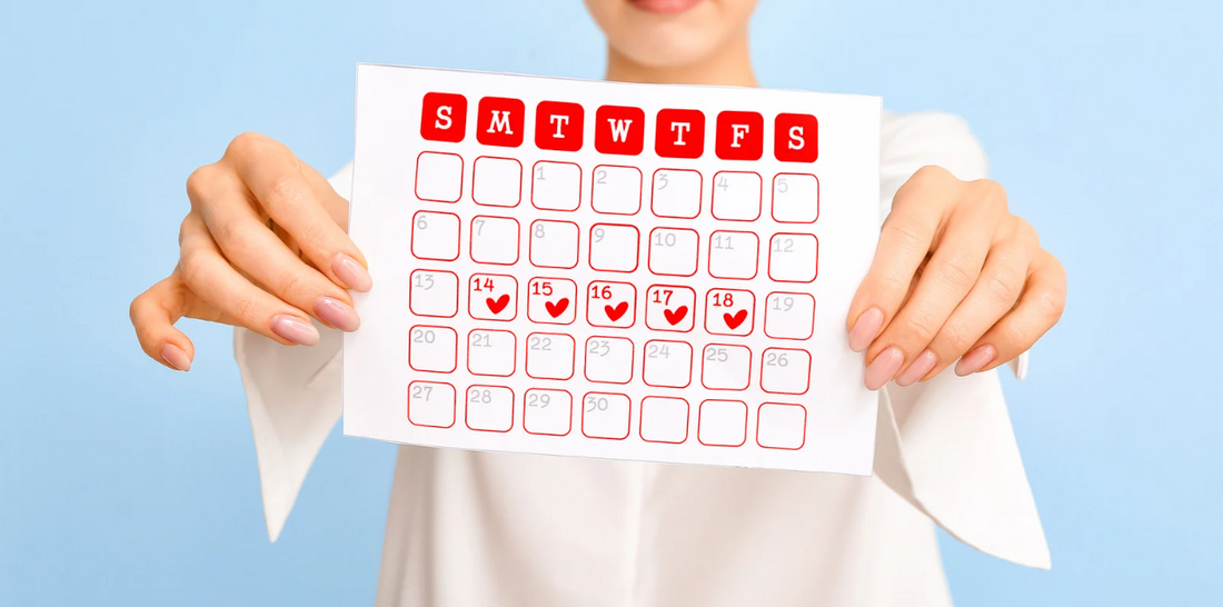 A calendar with hearts on specific dates, held by a person.