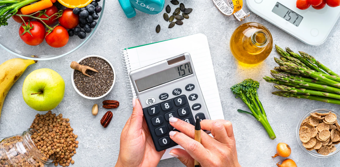 A photo of a calculator, fruits and vegetables 