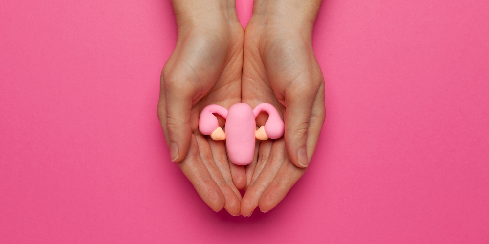 The image is a close-up of a pair of hands holding each other. The hands appear to have painted nails and are of a pink flesh tone.