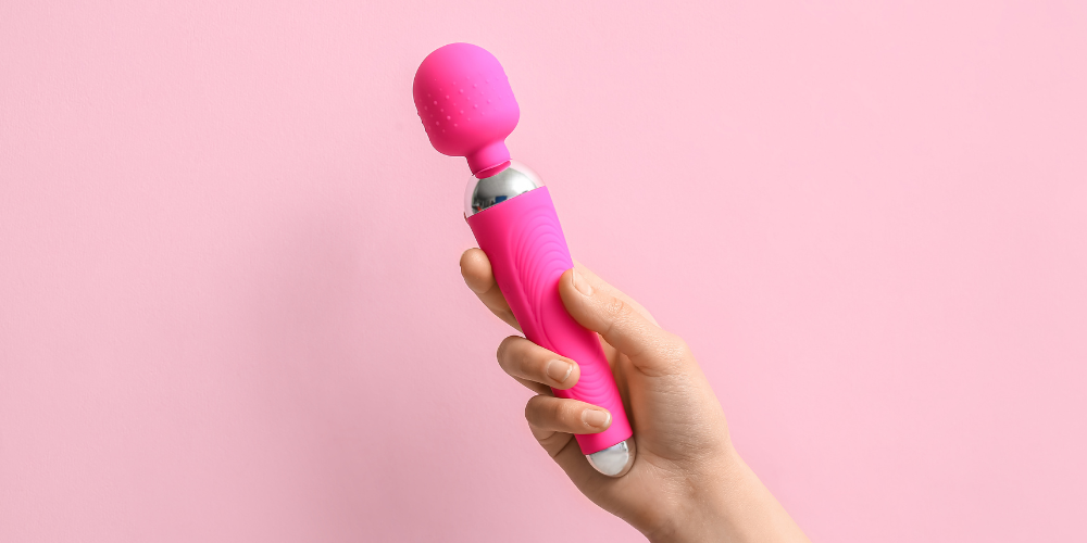 The image shows a person holding a pink balloon. The person's nails are painted magenta, and the image includes a cosmetics brush and a toothbrush.