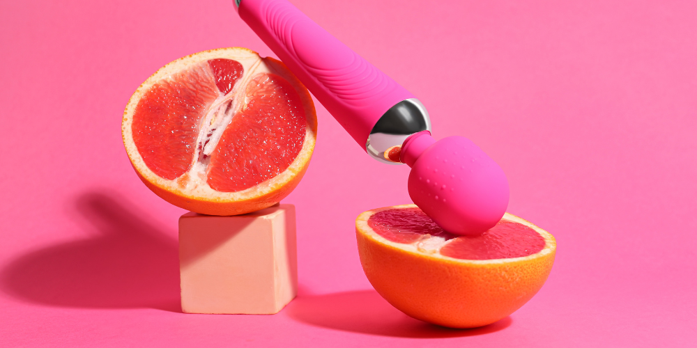 The image shows a pink surface with a pink background, featuring various pink objects related to citrus fruits such as oranges, lemons, grapefruits, and mandarins.