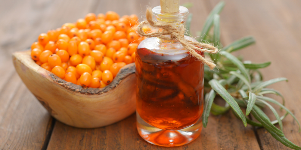 The image shows a bowl of sea buckthorn.