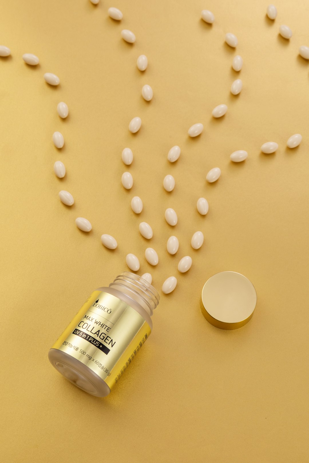 a bottle of pills spilling out of it