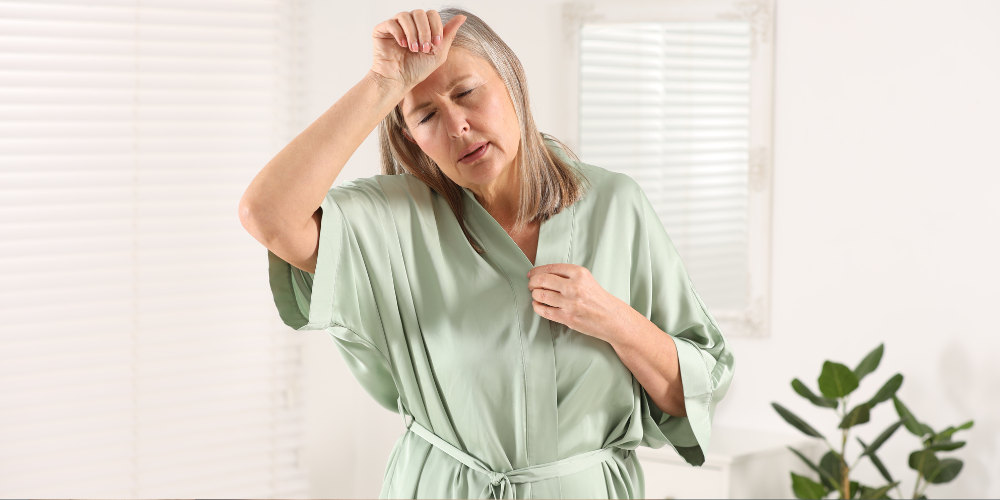 a woman in robe sweating