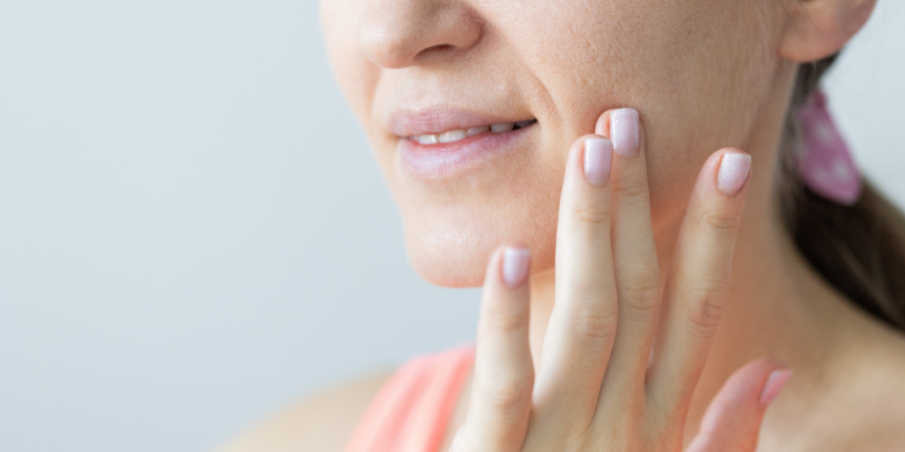 a close up of a woman's face and skin