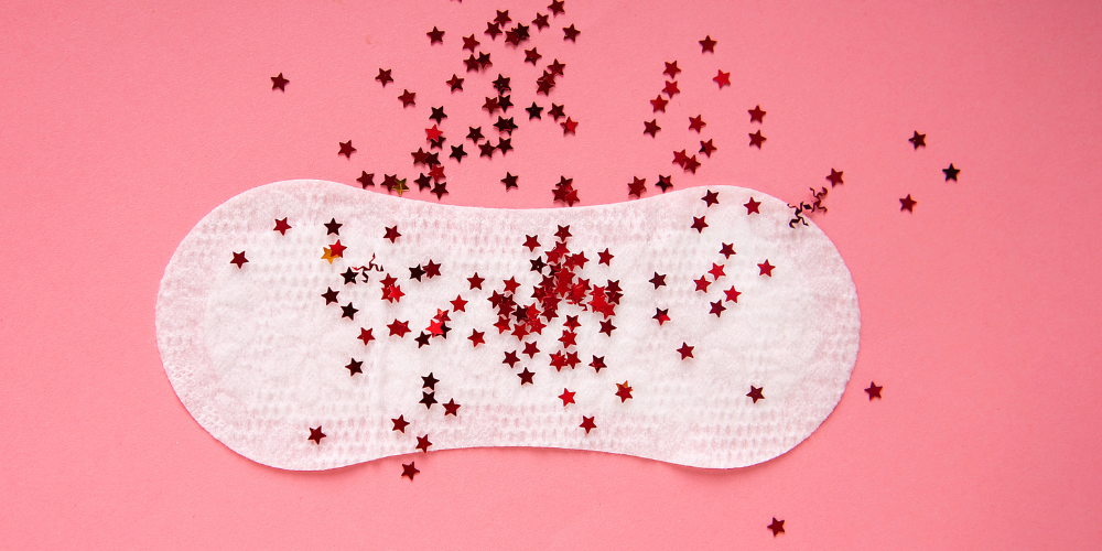 The image shows a napkin with little red dots 