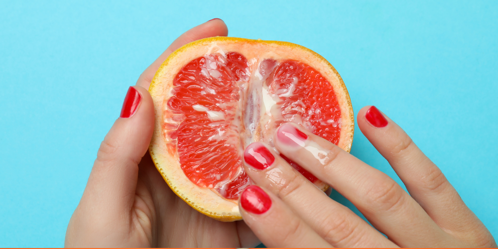 The image shows a person holding a juicy fruit.