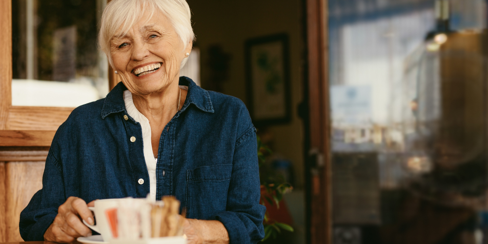 an old woman having a cup of coffee