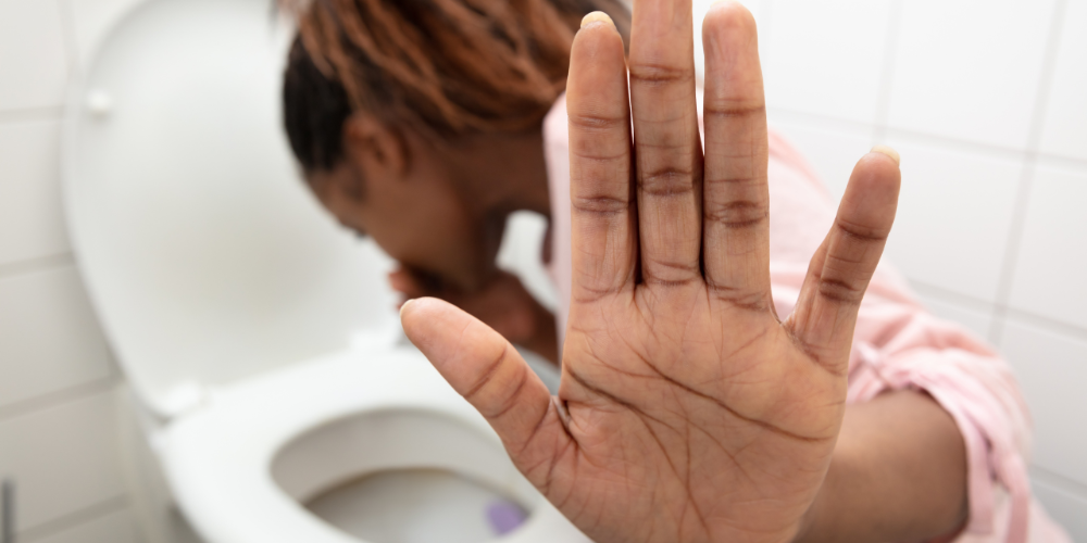 The image shows a woman inside the bathroom.