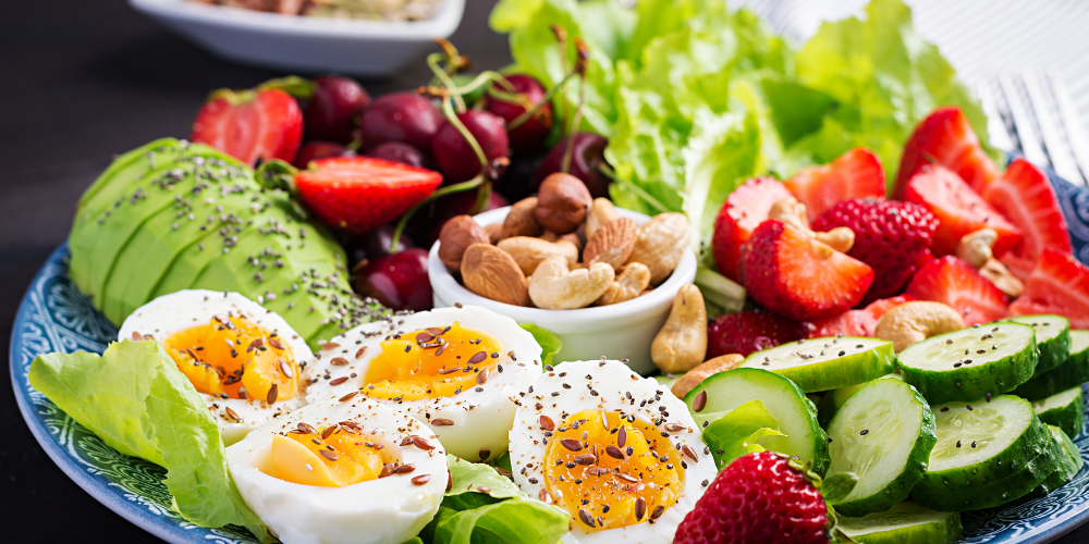 a bowl of salad and fruits