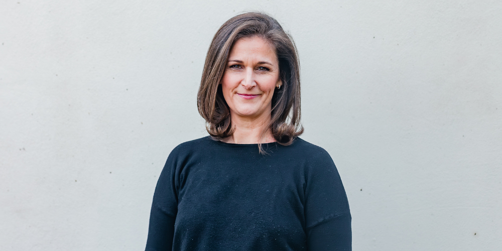 a woman wearing a dark blue top