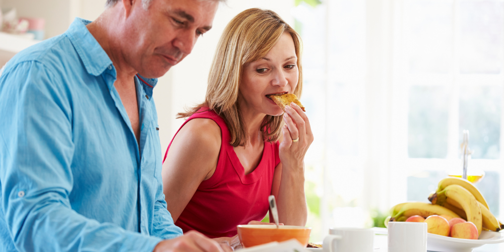 a couple eating breakfast