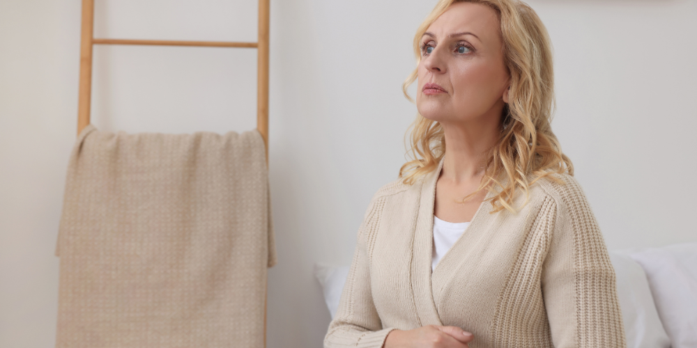 a woman sitting indoors