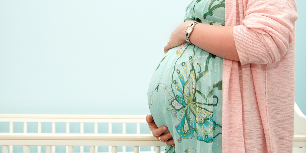 a woman outdoors pregnant