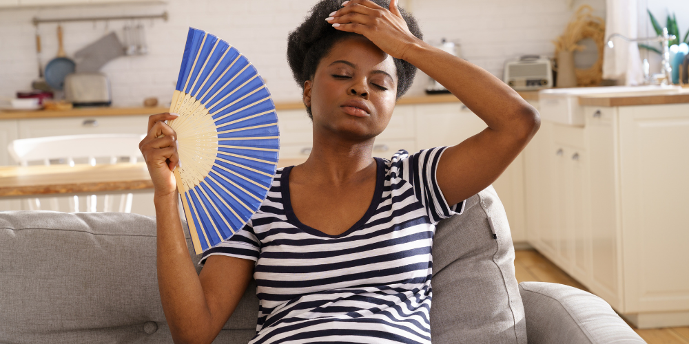 a woman fanning herself