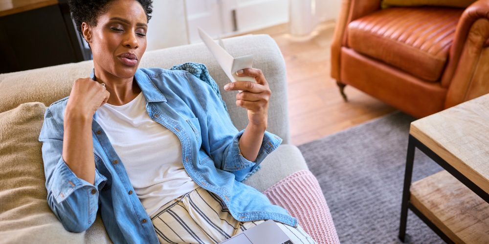 The image shows a woman inside the living room.