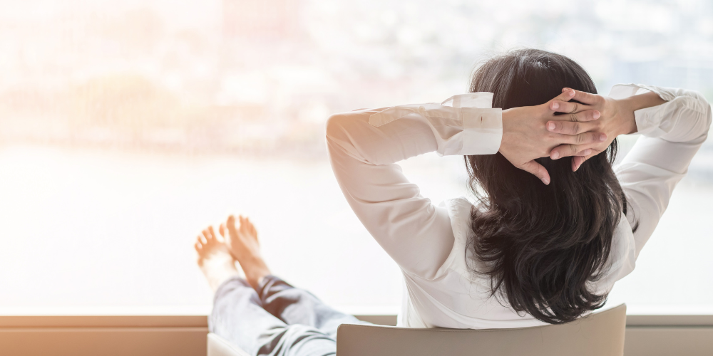 The image shows a woman relaxing indoors.