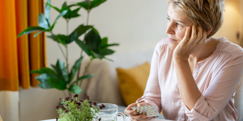 The image shows a woman in a living room.