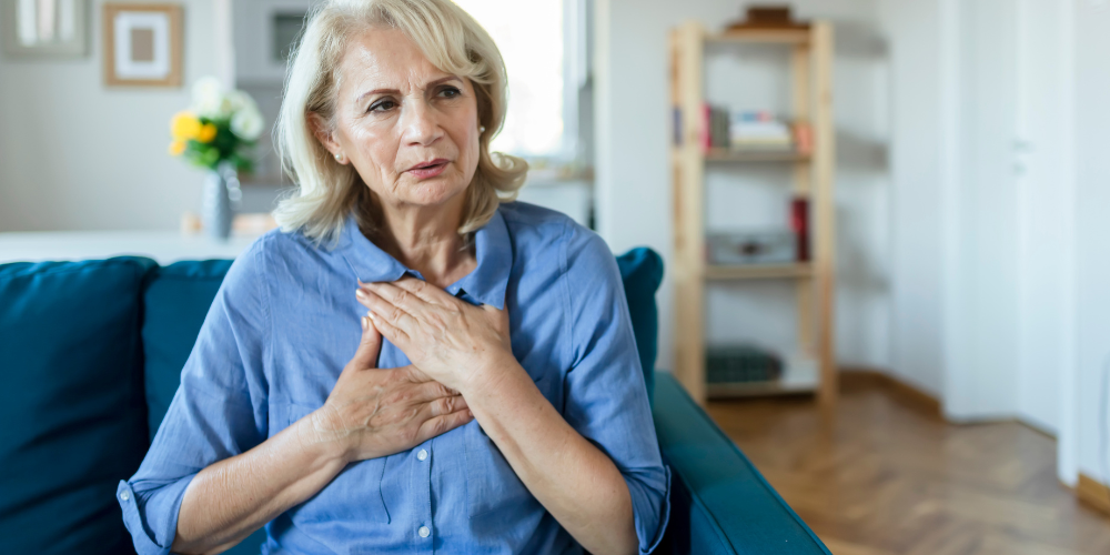 an old woman sitting indoors