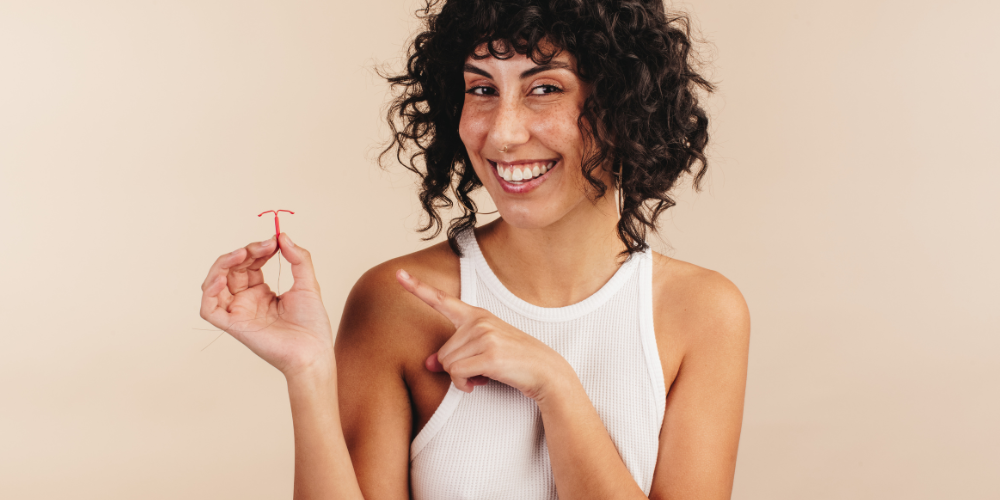 a woman holding a red object