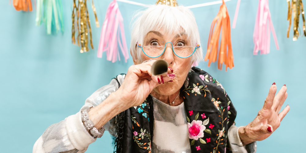 an old woman with a party hat