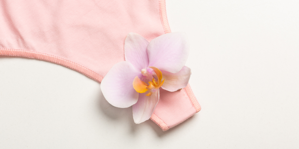 The image shows a pink underwear with flower on it.