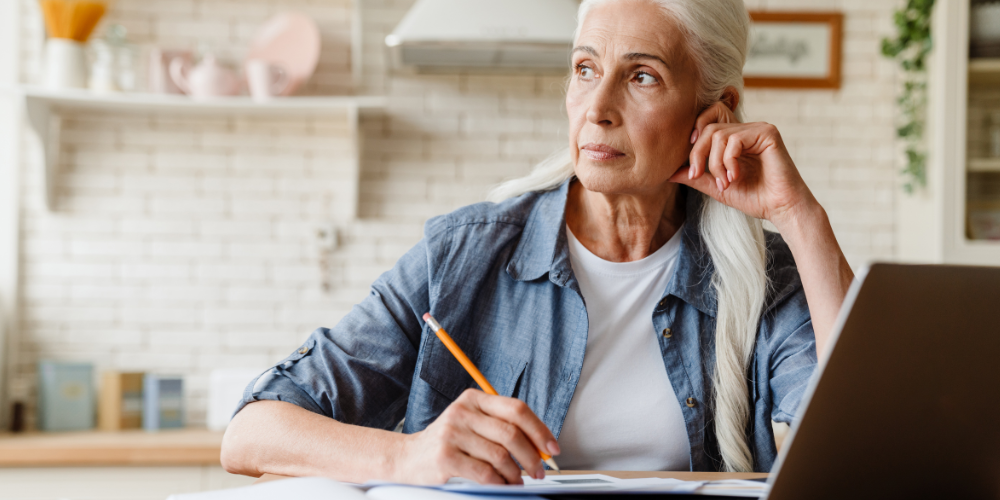 a woman holding a pencil 