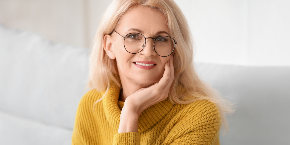 a woman wearing a yellow top 